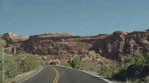 Colorado National Monument Park near the city of Grand Junction. Sheer-walled, Red rock canyons, Rim Rock Drive, Towering monoliths within a vast plateau and canyon panorama USA