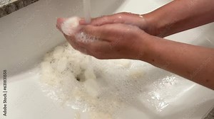 Biodegradable starch foam peanuts being dissolved in sink water