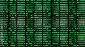 Binary code - computer program or concept of digital software development. Futuristic cyberspace with binary code falling down. Running process of the program