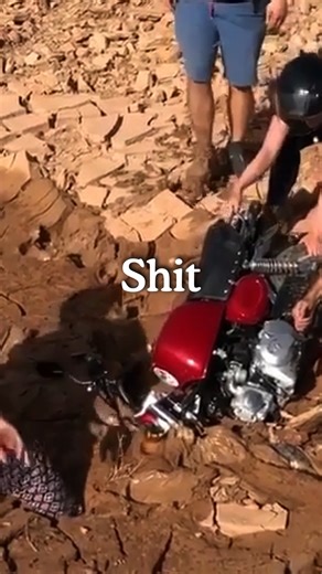 "Yep. Definitely stuck." A masterclass in parking a monkey bike in a puddle of mud in an otherwise bone dry river bed. Here's the full story... (You can bury your own miniature bike in mud this April if you want the real life version.) "We were a curious lot so when we saw a dirt road leading to a cliff we obviously thought, 'what an excellent place to explore'. After playing king of the mountain we observed a dry river bed a few miles away, immediately we were struck with inspiration. DRAG RACE