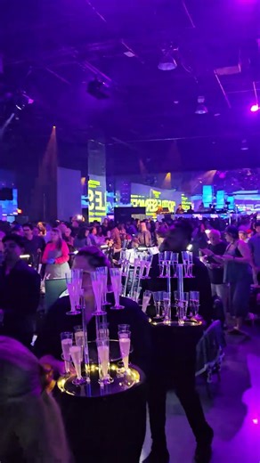 Champagne sparklers blazing, incredible display holders wrapped in screens on all four sides