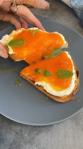 4.9K views · 19 reactions | Have you tried a Hachiya Persimmon? It’s divine. Just make sure it’s super soft and ripe or it will taste like poison. Not joking! This ricotta toast was so simple. Just sourdough toast, ricotta, the inside of a Hachiya persimmon, olive oil, salt and mint. Highly recommend! #Persimmon #easysnacks #easyrecipes | Ain’t Too Proud to Meg | Facebook