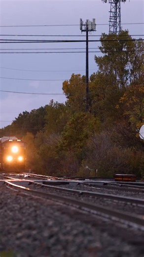 Southbound CSX X227, an autorack extra from the Lake State Railway, rolls through Plymouth on a rainy evening in Michigan. #railroad #railway #train #rail #reels #fall #rain #weather #october | Craig Hensley Photography