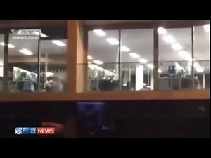 Two coworkers caught having sex in the office from a bar opposite
