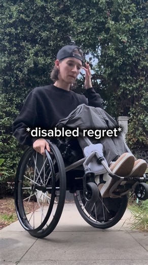 Aly Corvin on Instagram: "✨WHEEEELIEEEES✨ I’m fully aware I’m losing it… 💀🤣 It’s worth a shot… Alt text: A woman in a wheelchair backs away from the camera and does a wheelie and talks to the camera. Captions are on screen for accessibility. #WheelieGirl #100k #NewYears"