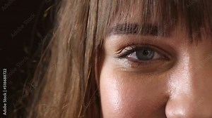 Raise your awareness to consciously shift your perspective to look for the positives in life. Closeup of a young woman with beautiful green eyes. Zoom in on a brunette woman feeling happy and content