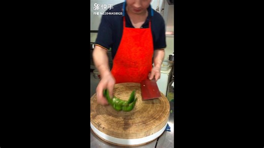 Chopping green pepper into thick segments on wooden board with clean knife technique