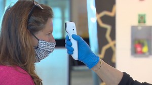 Now mandatory at Canada's four largest airports, domestic passengers will have their temperatures checked as part of a screening process when they pass through security. | CBC News