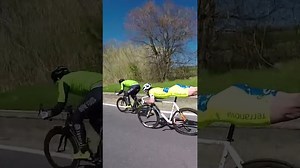 Bicyclist's Superman plank move during race.