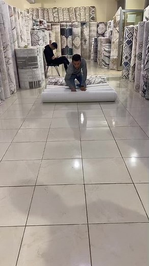 Exploring Intricate Carpet Designs in a Retail Store