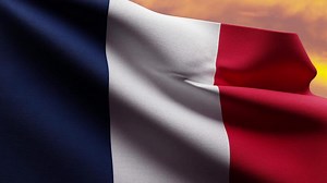 French Flag Waving at Sunset on Bastille Day