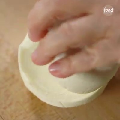 Put a bow on this little phyllo dough-wrapped cheese package and call it a present! That's how good these look, Ina Garten! 😍🎁 Stream more of #BarefootContessa on Max! #StreamOnMax Save the recipe: https://foodtv.com/30zBqcp | Food Network