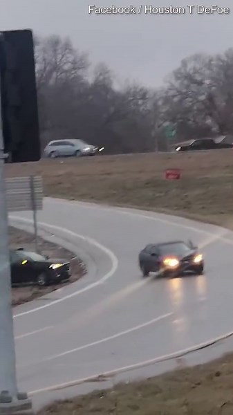 Moment woman jumps out of car she was driving after it hit black ice