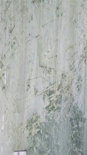 Esmeralda Light Quartzite imagined in a mudroom setting, where durability meets quiet refinement. Soft movement, natural strength, and a palette that elevates even the most utilitarian space. | AGM Imports Granite & Marble