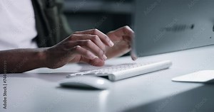 Business hands, typing on keyboard and night research for information technology, programming and software update. Person or programmer on computer in office with cybersecurity management or website