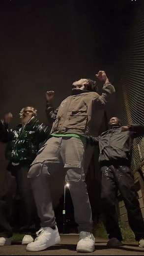 Coordinated Nighttime Dance Routine in Casual Streetwear