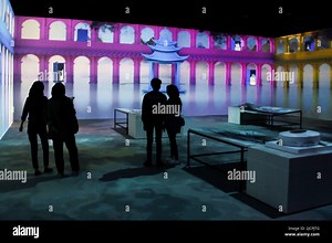 Bandung, West Java, Indonesia. 15th June, 2022. Visitors take a photo with the backdrop of video mapping to show the k-pop BTS in Bandung. The show, which was held by Kala Kini Nanti with Senyum ARMY, was held to commemorate the 9th anniversary of South Korean music group BTS as well as fundraising for out-of-school children throughout Indonesia. (Credit Image: © Algi Febri Sugita/ZUMA Press Wire Stock Photo - Alamy