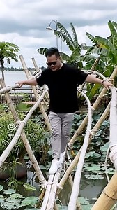 A childhood memory. Would you try? Cầu khỉ (“monkey bridge”) in Vietnam is a handmade bamboo or wooden passway across a stream or gully. The “monkey bridge”, as a uniquely Vietnamese traditional symbol Do what you love. Love what you eat. @mr.gaoviet #monkeybridge #travelvietnam #mientay #cantho #cầnthơ | GAO Viet Kitchen & Bar