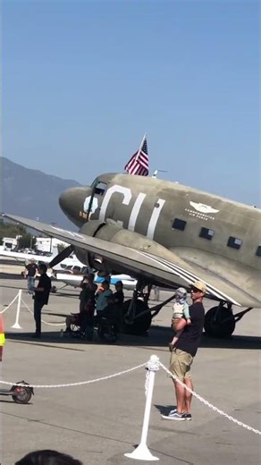 Boeing Stearman biplane taking off. Amphibian flyby.