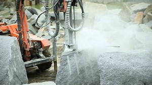 Drilling drill in granite quarry