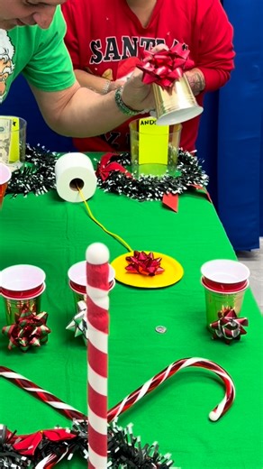Christmas carnival wreath toss over candy cane plunger game where cash prizes come from pulling a Christmas bow on a string through a roll of toilet paper | Doug and Friends