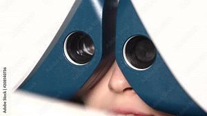 Close-up of working phoropter and eyes of patient. Device is using for diagnostic vision and selection of glasses and lenses