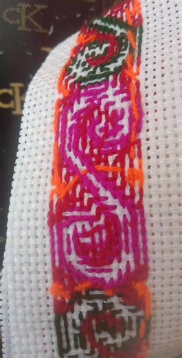 Intricate Embroidery Patterns on White Fabric