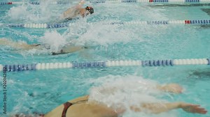 Girls racing in swimming pool lanes / Provo, Utah, United States