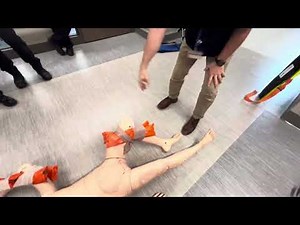 Splinting the knee, using two long boards and a ace bandage