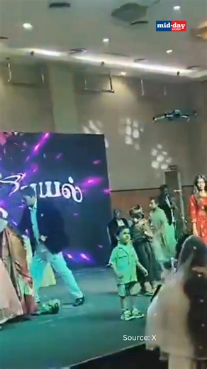 A woman collapsed and died while dancing on stage during a wedding reception in Mamallapuram, Tamil Nadu. Identified as Jeeva, she was rushed to hospital but declared dead on arrival. The incident, caught on video, has gone viral online. Similar sudden collapse cases have been reported in recent months, raising concerns over rising instances of unexpected cardiac arrests during physical activity. #TamilNadu #WeddingTragedy #ViralVideo | MiD DAY