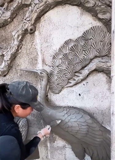 Chinese Woman Transforms Building Wall Into Detailed Cement Relief Artwork || ViralHog