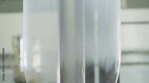 Blown extruder material processing equipment used at the production plant. Blown extruder processing the plastic material. Blown extruder processing plastic to produce eco-friendly material.