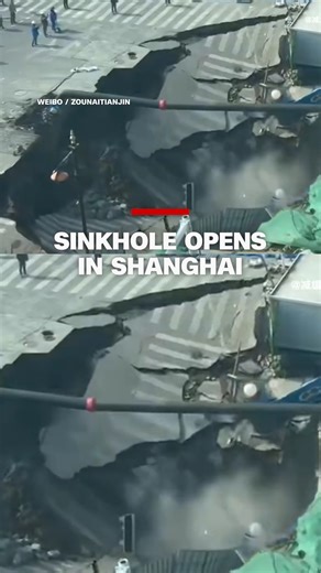 Video shows a large sinkhole appearing at a suburban railway construction site in China's commercial capital. The metro operator said it was triggered by a water leak. No casualties were reported. | CNN