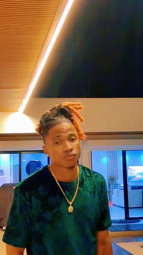 Stylish Indoor Fashion Featuring Unique Dreadlocks