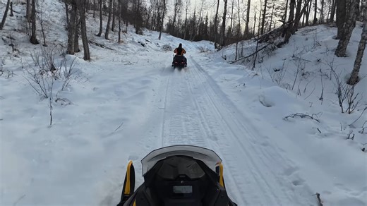 After dog sledding, relaxing snowmobile ride through Alaska’s quiet winter trails