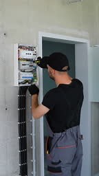 Electrician installing electrical panel. Electrical installation and...