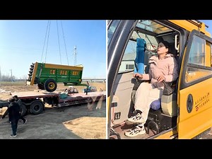 Female Crane Operator Heze Skillfully Lifting Heavy Machinery and Loading It onto a Flatbed Trailer