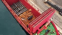 Aerial view of loading a cargo ship in a port. Working day in a sea...