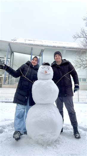 Building Our First Snowman Together as a Family