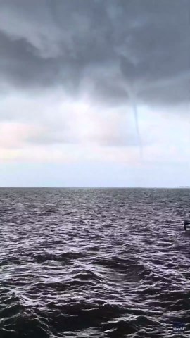 Waterspout Glides Across Mobile Bay as Lightning Strikes