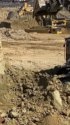 CAT 375 excavator loading overburden into a haul truck with solid power and smooth precision. Strong digging force, fast cycle times, and consistent production on every load. #CAT375 #Caterpillar #MiningLife #HeavyEquipment #Overburden #HaulTruck #Earthmoving #fblifestyle | HeavyBuild Project