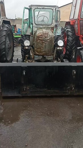 Close-Up of a Worn Blue Tractor's Key Features