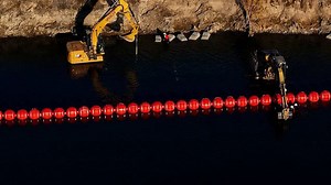 Drone video shows buoys barrier going up at US-Mexico border river