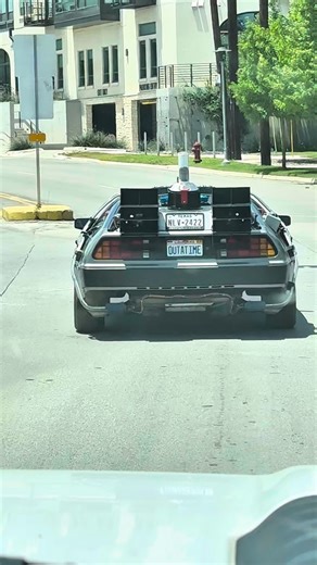What it looks like when a fan is chasing a Delorean Time Machine through the streets to catch a glimpse | Delorean Rental
