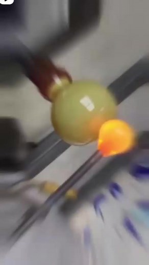 Molten hot glass art in progress for a cold winter day! Chris assists April as she continues making new pieces for a specially commissioned contemporary glass sculpture. It's a juicy process that starts from a small slice of a solid colored glass rod and ends with a spin and a skillful bit of glass wrangling! Visit our Instagram @epiphanystudios to watch the reel till the end to see a piece similar to what is being created. #mondaymotivation vibes #itsawrap #spin #freefire | epiphany studios