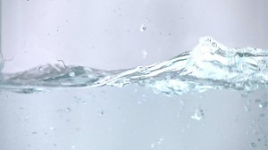 Close up of water sloshing in a glass - Free Stock Video
