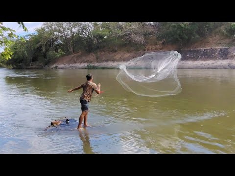 Cast net fishing in El Salvador's largest river