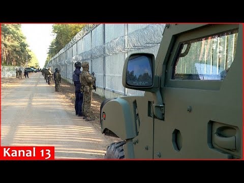 Media given rare access in Poland to heavily fortified zone along border with Belarus