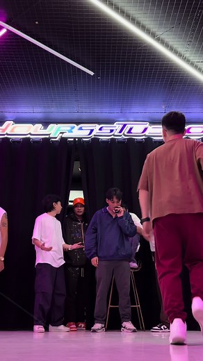 Choreographed Dance Routine by Young Men in Dance Studio