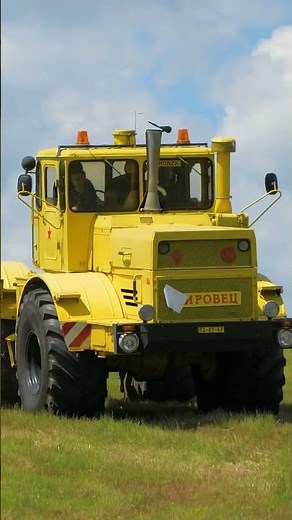 Two beautiful Kirovets K700 Tractors playing in a field in their natural habitat Traktoriáda Hájek